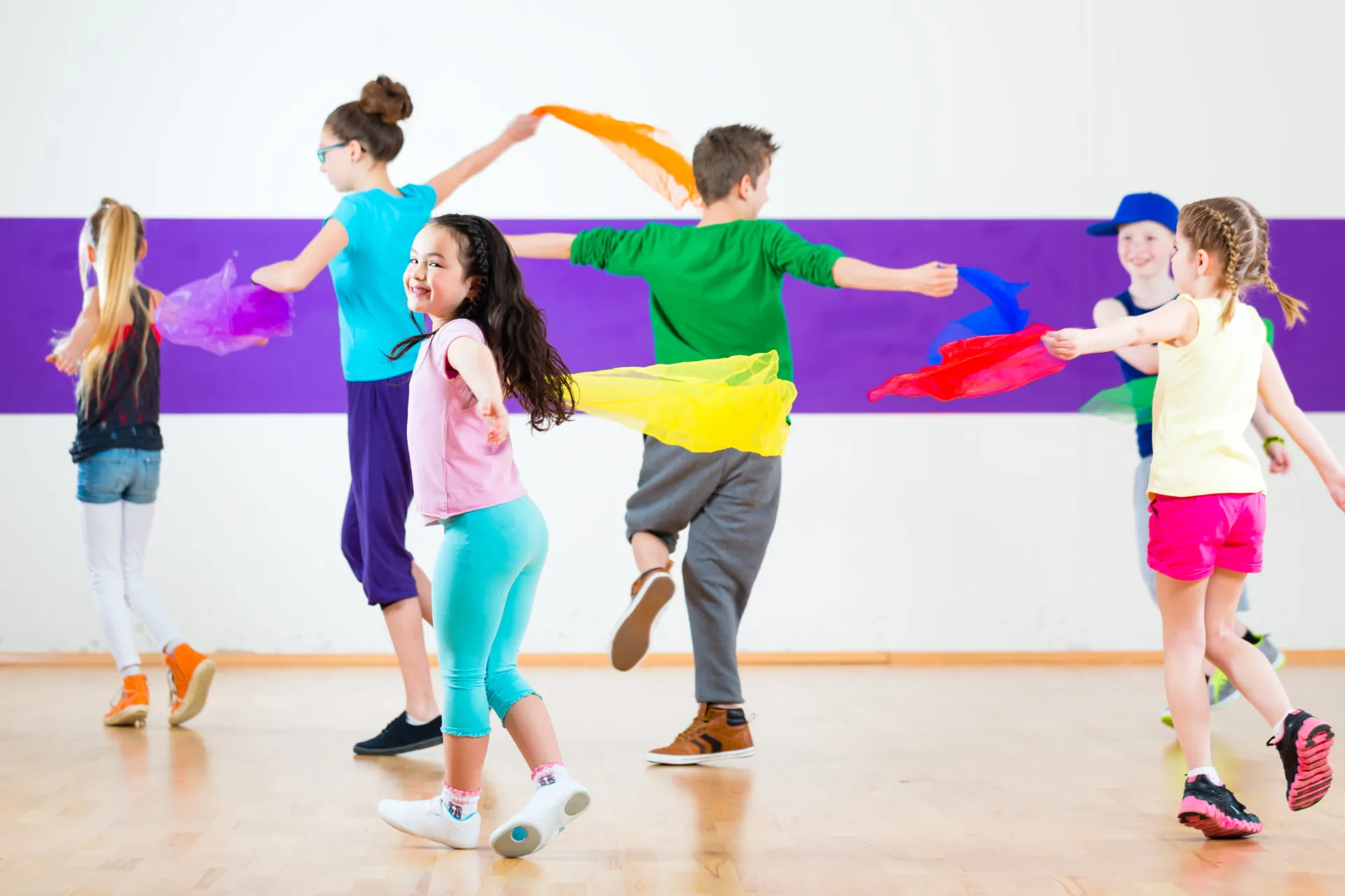 16288683 kids in dancing class traninng with scarfs