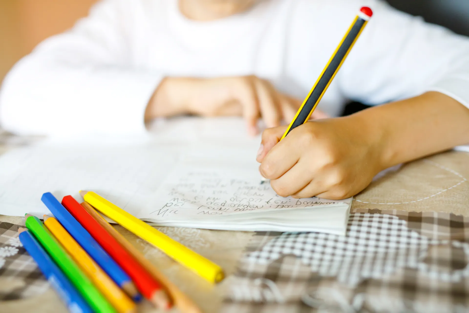 31557565 child doing homework and writing story essay elementary6