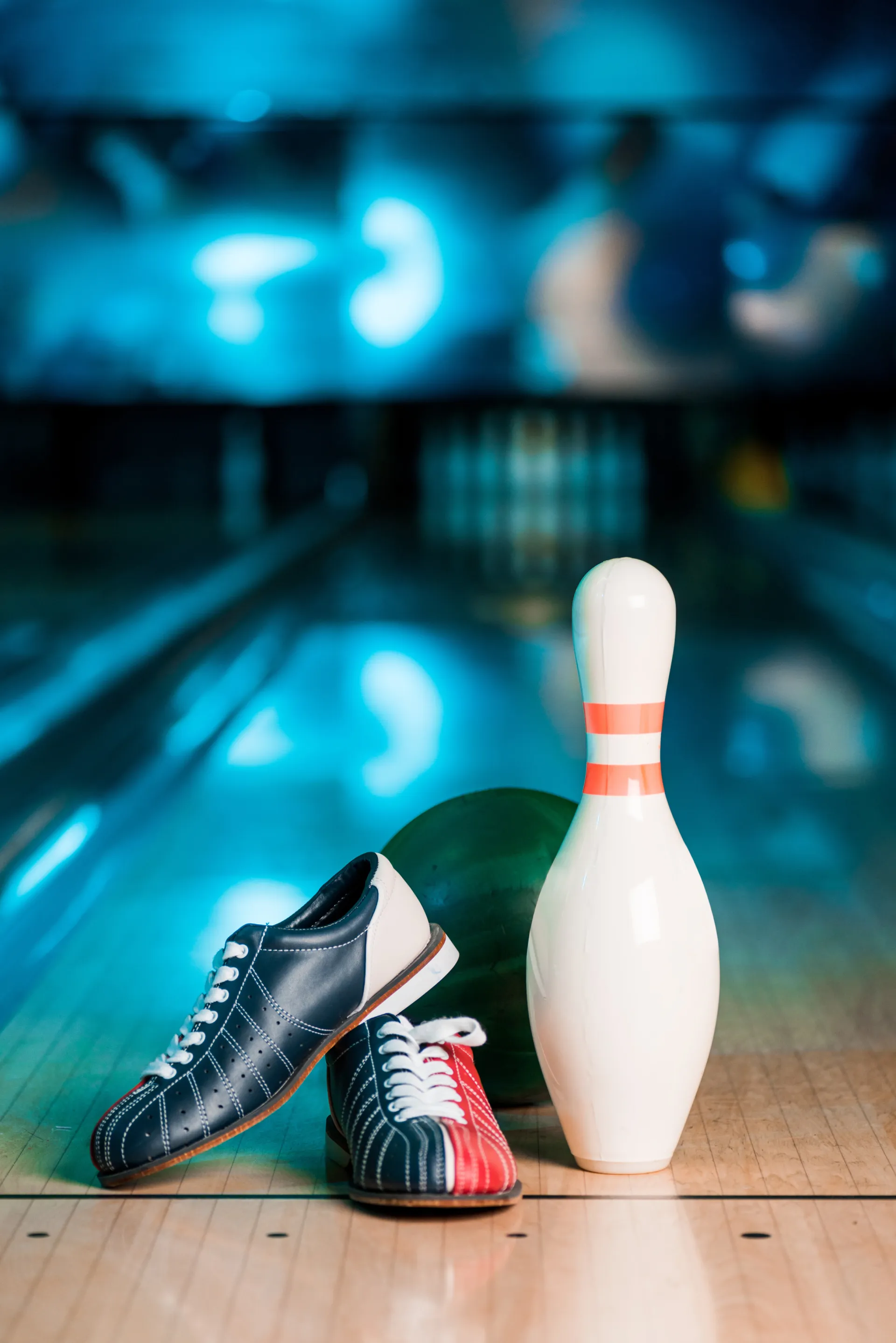 mp36212078 selective focus of bowling shoes ball and skittle on