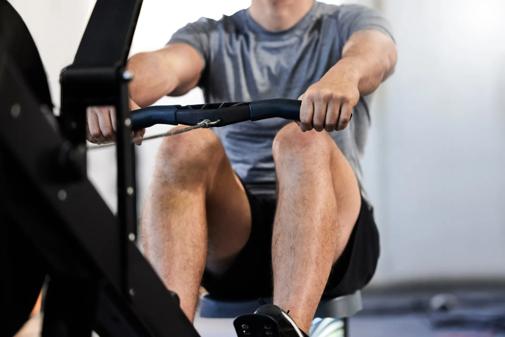 mp64633903 athletic man fitness and health in gym on rowing