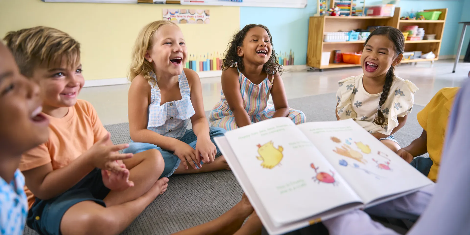 mp64942696 female primary or elementary school teacher reads story